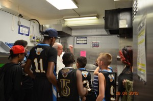 Team receives a tour of the actual soup kitchen from the manager.              